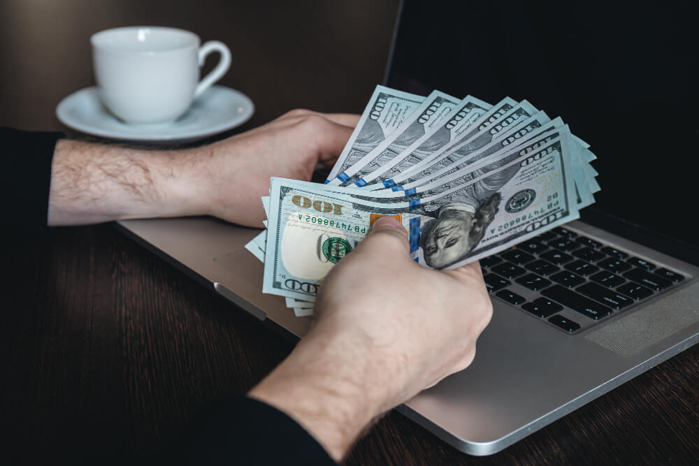 a person holding some money