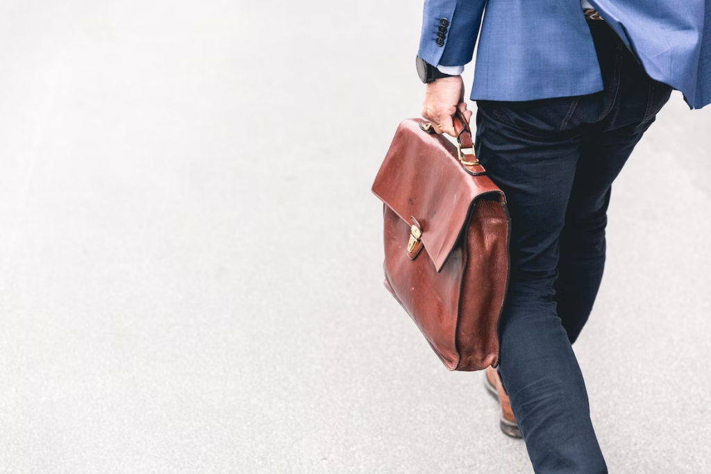 a close-up shot of a man's bag while walking