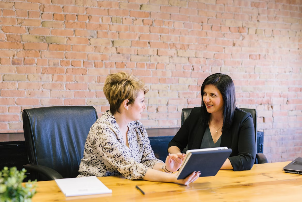 two woman discussing something