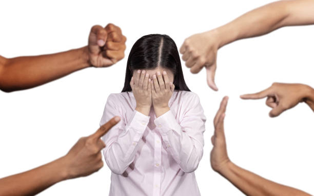 a woman hiding her face from discrimination