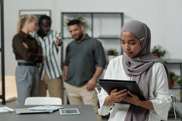 a woman wearing hijab being discriminate at work